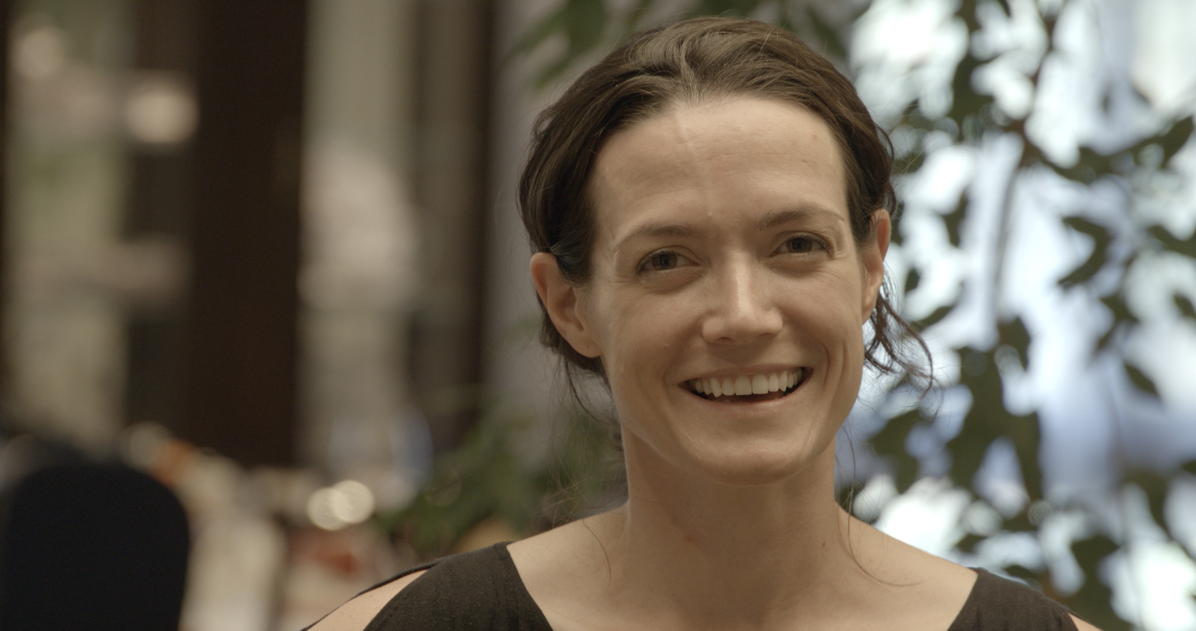 BTS woman smiling outdoors