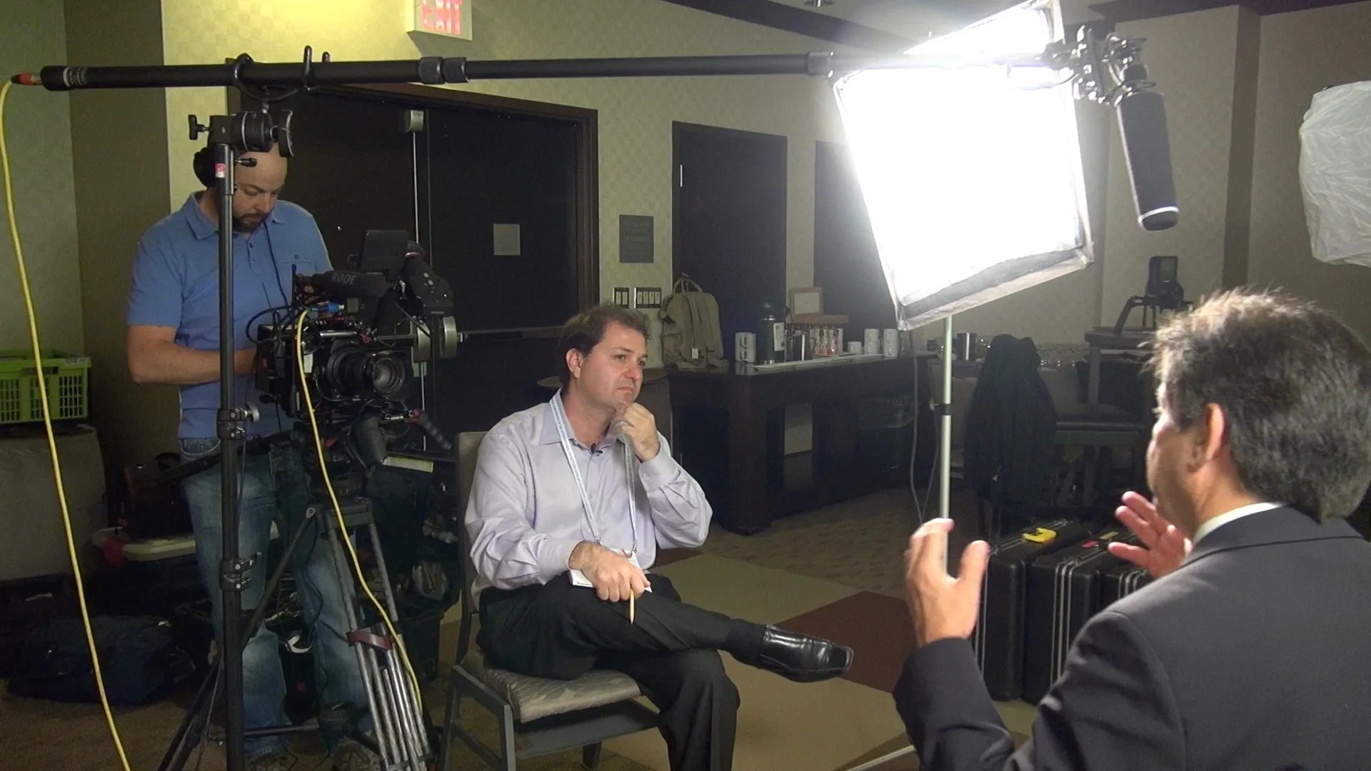 Breaking the Silence film production — interview setup with director and crew